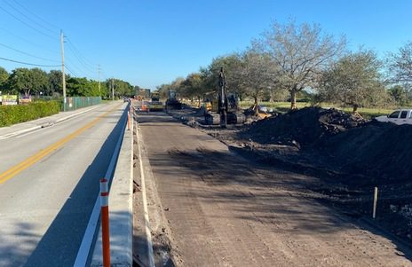 Roadway construction zone with equipment and traffic control