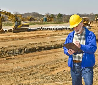 Construction worker documenting work at an active site